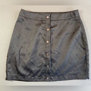 Kittenish Black‎ Mini Skirt snaps up front Size Medium